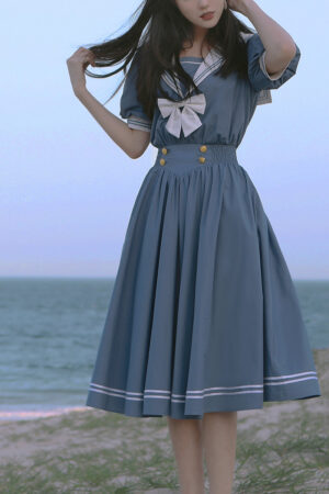 Dusty blue sailor lolita OP dress full body front standing posture female model seaside beach landscape authentic lolita fashion