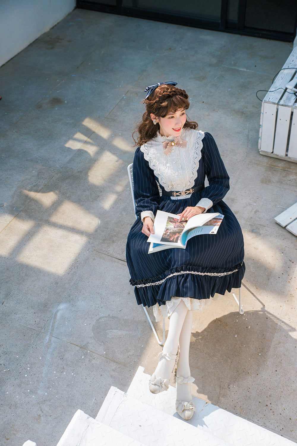 Classic Lolita OP dress neckline and collar detail showing delicate lace edging and bow accent embellishment