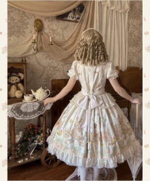 Back full-body view of toy print kawaii lolita dress featuring large detachable back bow, peter pan ruffled collar, floor-length ruffled skirt hem, model in tea-themed vintage bedroom with curly blonde wig and hair accessories