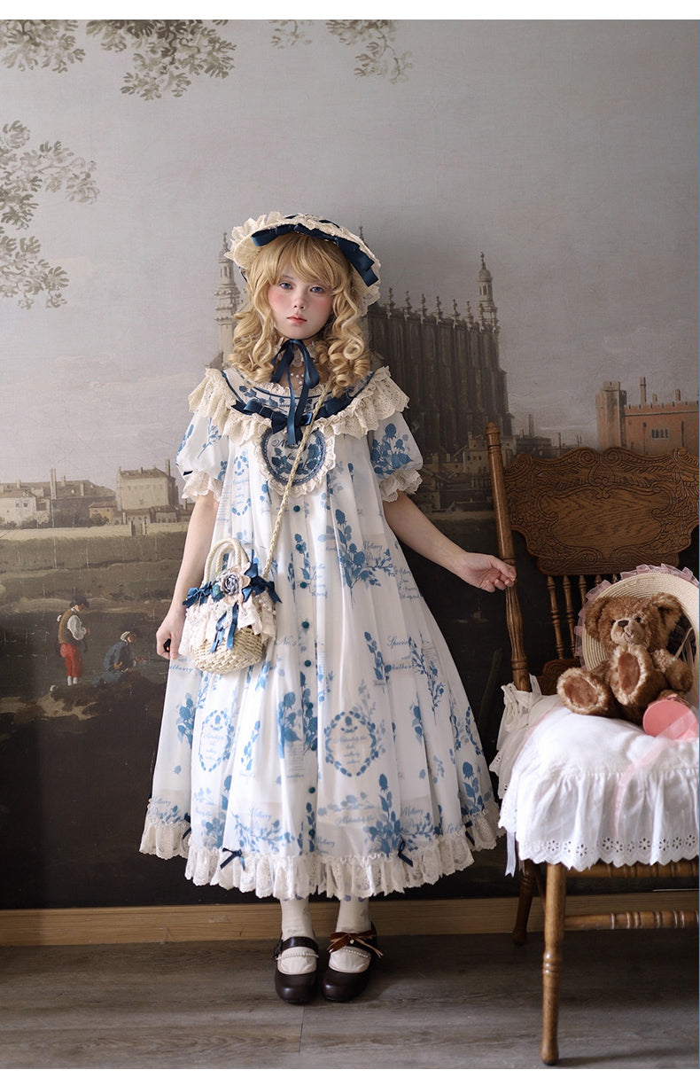 Detail close-up view of blue and white porcelain print pattern on Lolita dress fabric showing fine print quality and pattern accuracy on crinkle polyester material