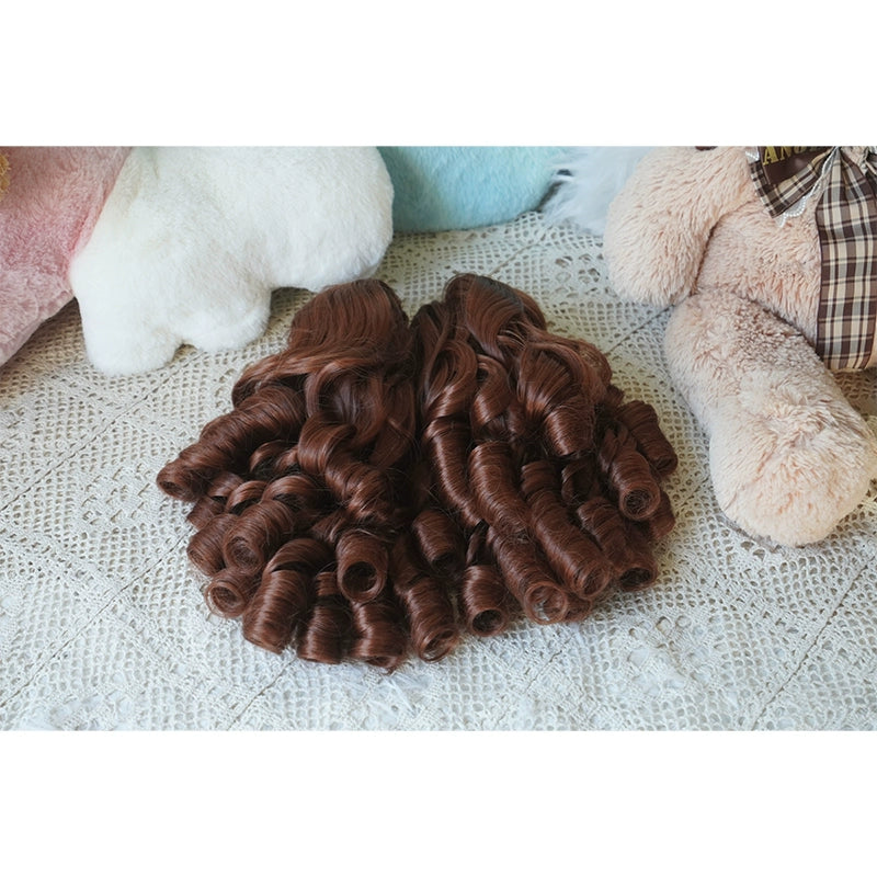 Honey brown Lolita detachable spiral ringlet ponytail pair only shown on mannequin with warm plush background aesthetic