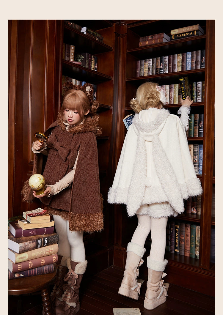 Front and back view of brown winter lolita cape with fuzzy hem and white cape with back bow and plush trim, models holding vintage decorative props in library setting
