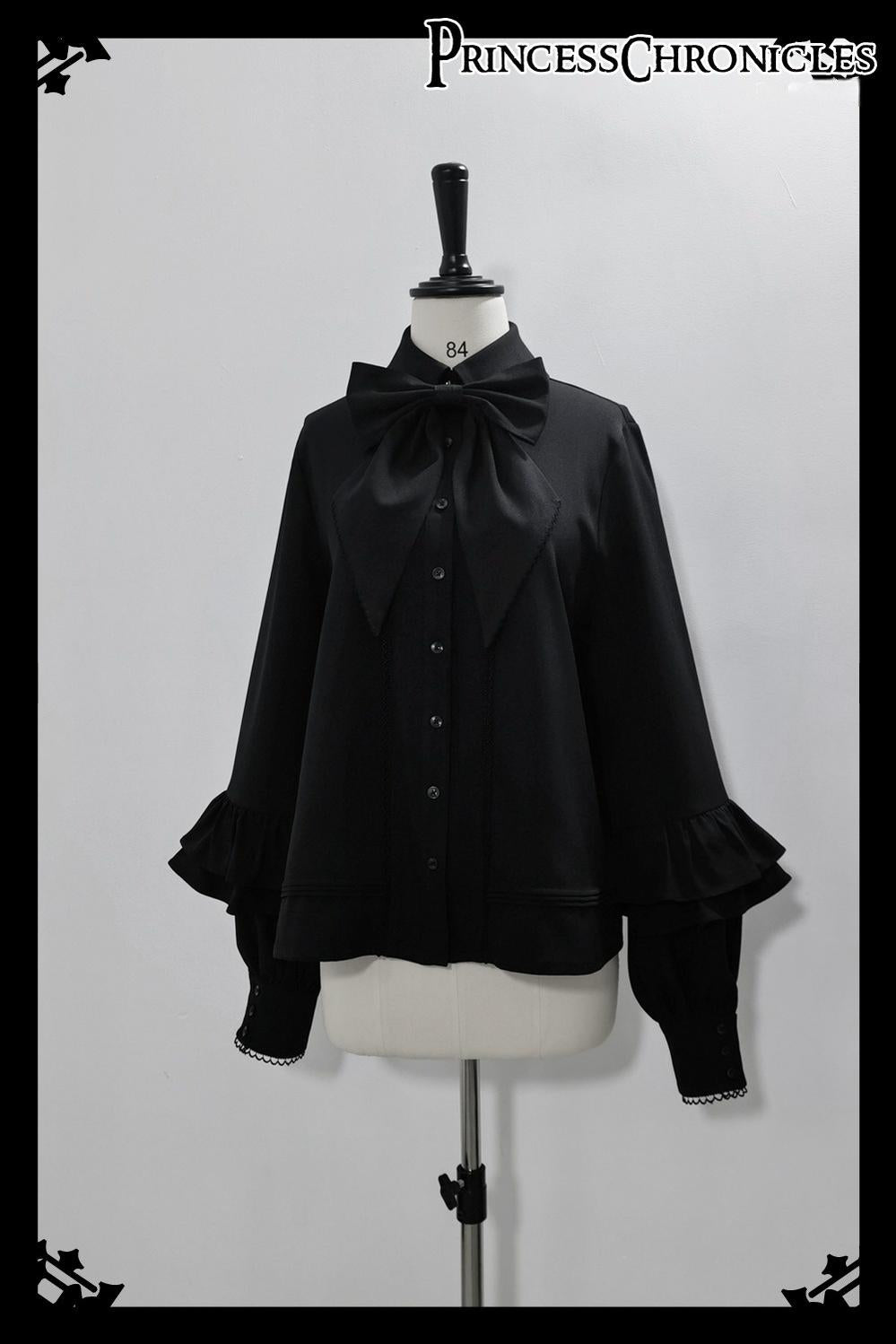 Black Ouji Lolita shirt detachable bow tie accessory close-up showing quality construction, drape, and formal statement-making design element for prince lolita coordinates