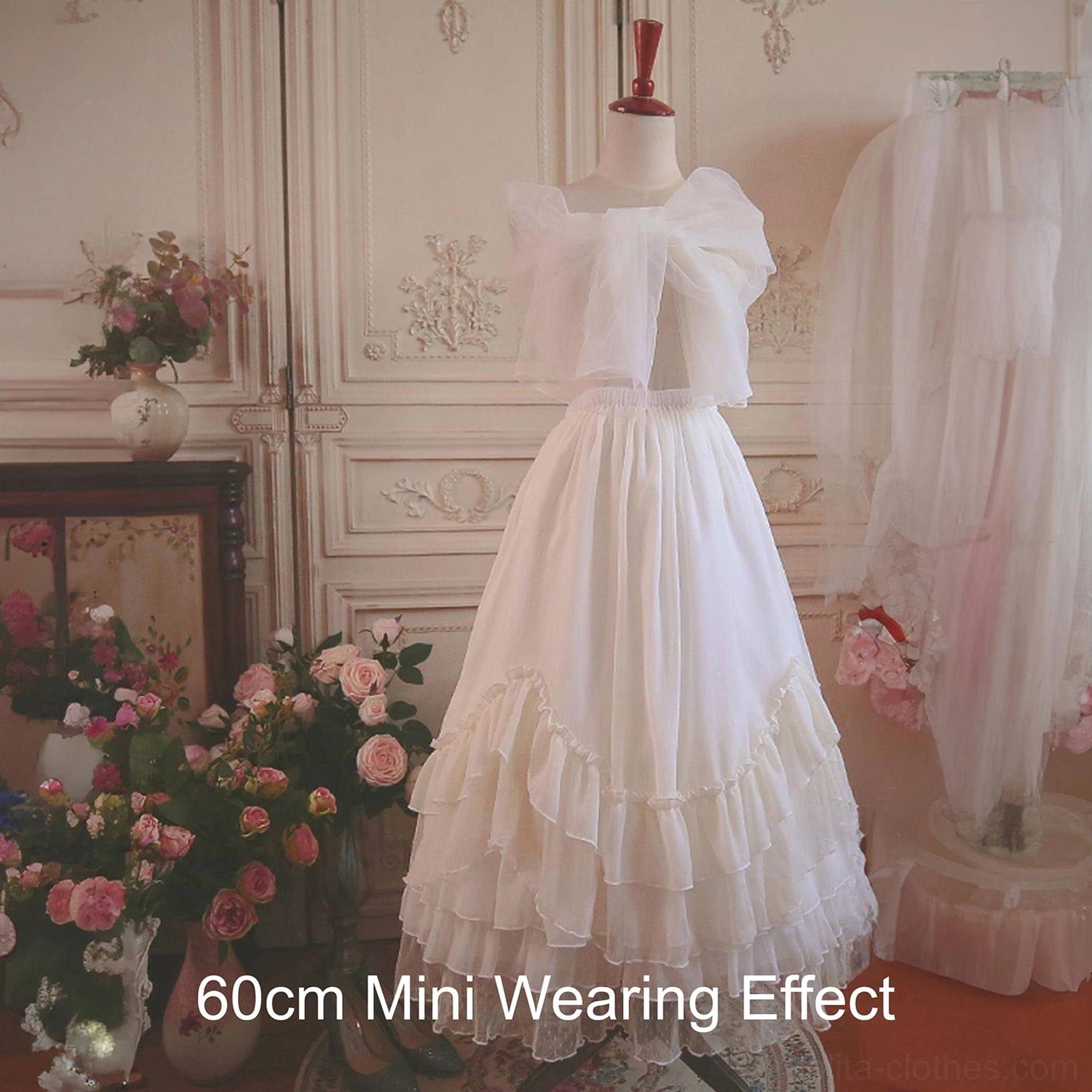 60cm mini Lolita petticoat wearing effect front full view dress form showing bow waist detail tiered ruffled layers warm off-white tone