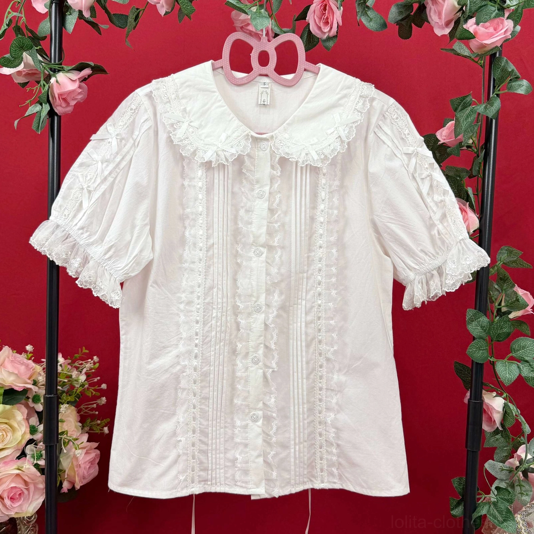 Adjustable back drawstring design on sweet lolita cotton blouse showing crisscross waist tie for customizable fit