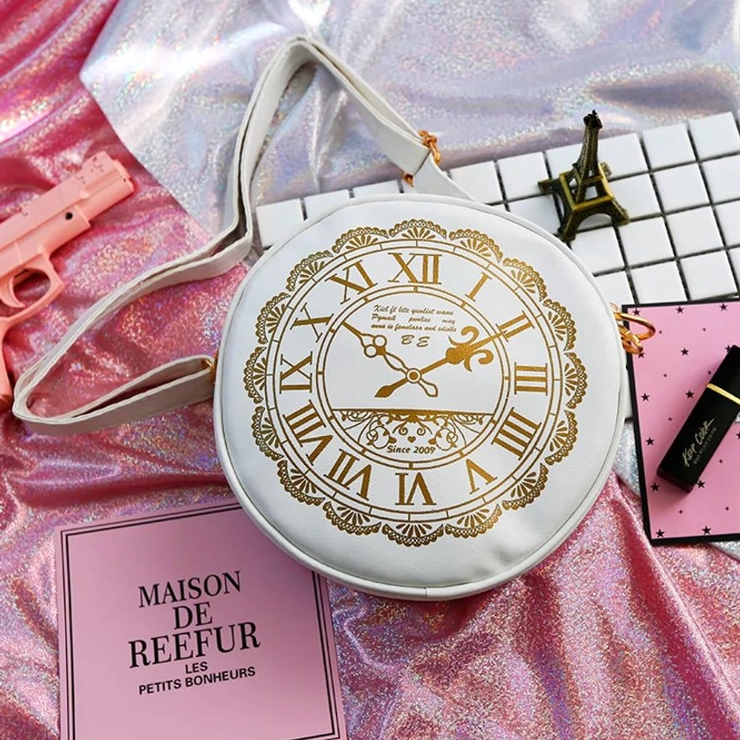 Alice Clock round lolita shoulder bag white base with gold Roman numeral print overhead view flat lay