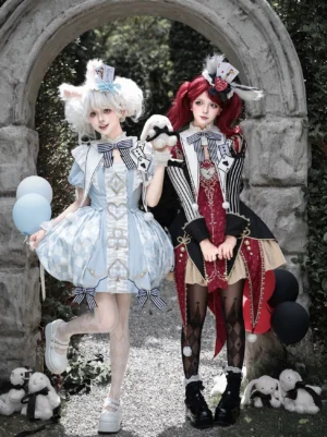 Two coordinated Lolita OP dresses comparison - light blue Alice-themed dress with bubble hem alongside red-black alternative style, both featuring matching hair accessories and embroidered details
