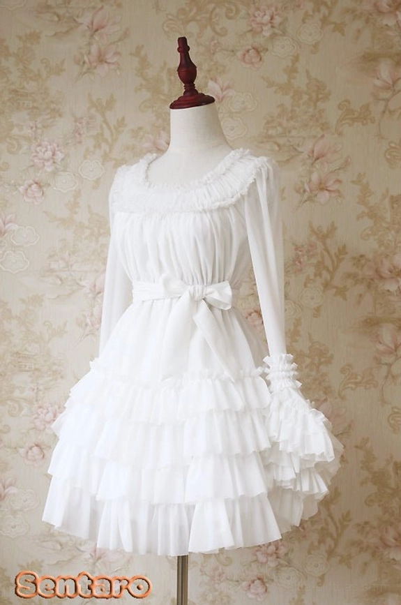 All-white Lolita dress with multi-layer ruffle skirt, long ruffled sleeves, delicate waist bow accent and classic silhouette