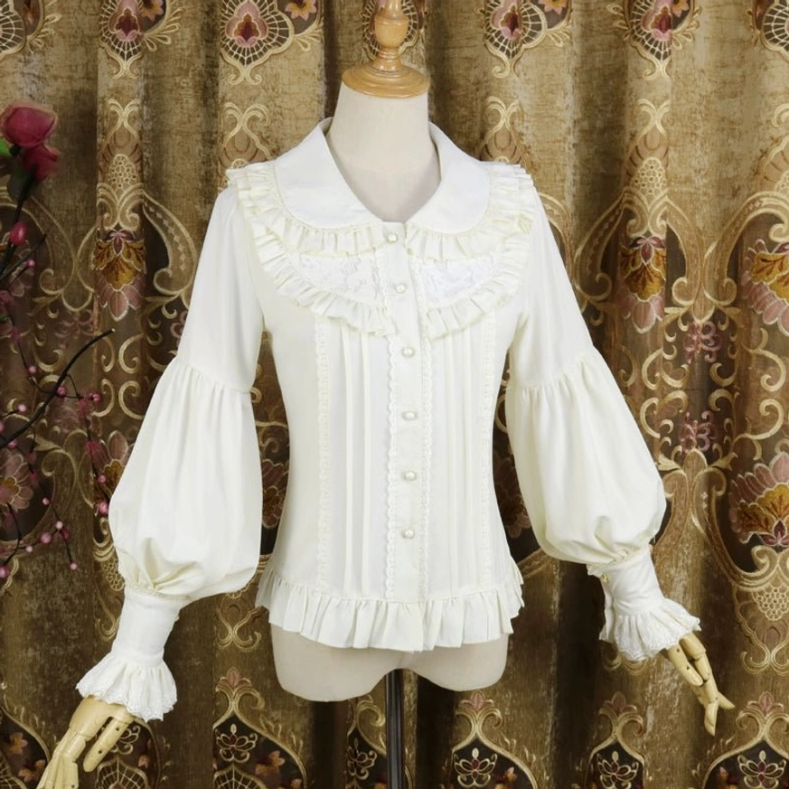 Apricot-cream classic Lolita Peter Pan collar blouse with ruffled collar, cuffs and hem, front pearl buttons and voluminous lantern sleeves