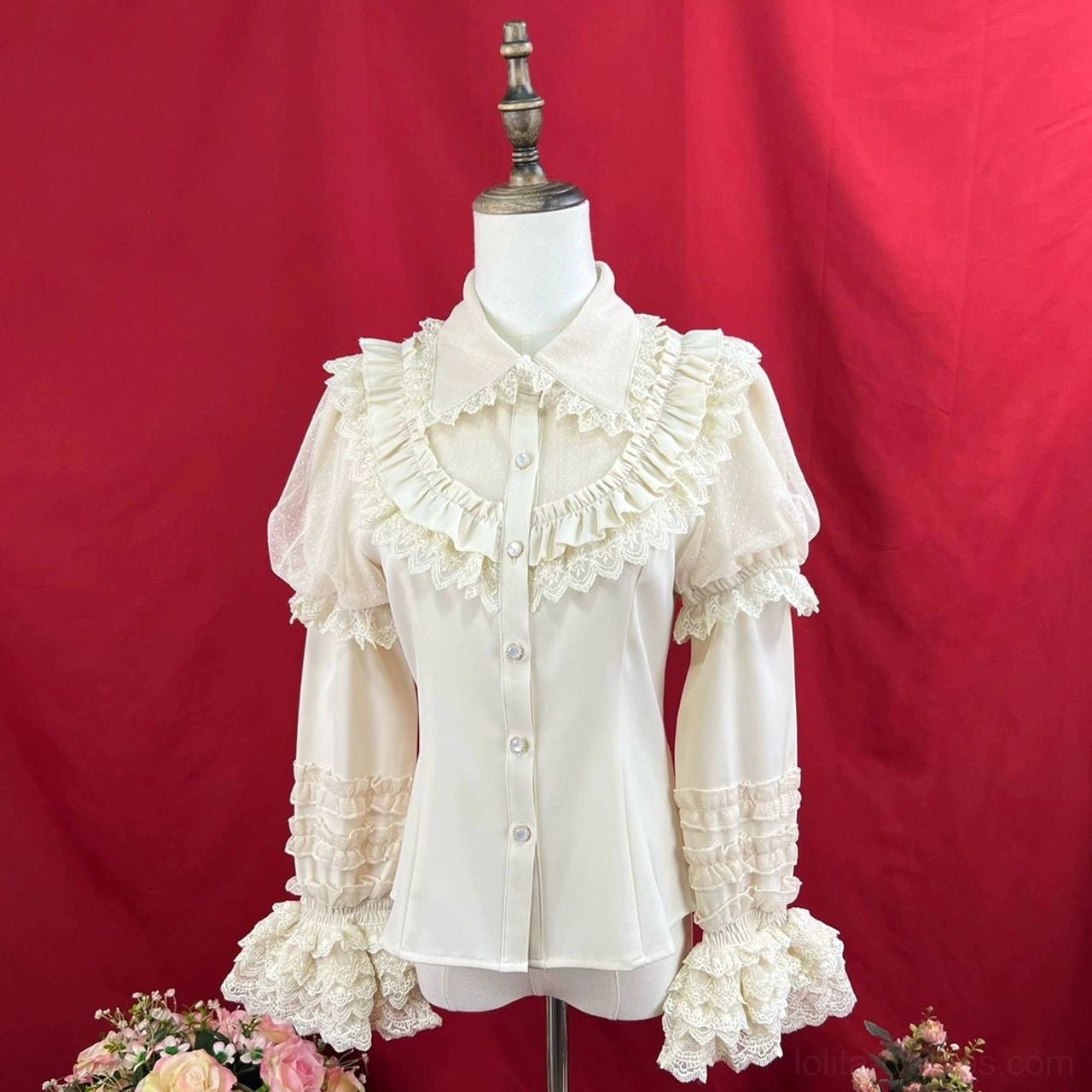 Apricot sweet lolita long sleeve blouse with pointed peter pan collar front button placket sheer lace ruffled sleeve panels and flared lace trimmed cuffs slim tailored fit on dress form