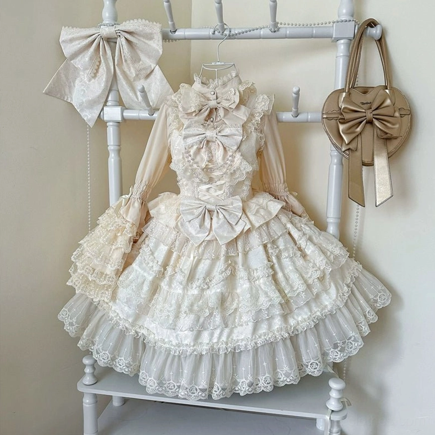 Apricot sweet wedding lolita JSK dress detail shot highlighting lace trim pearl embellishments and satin bow construction