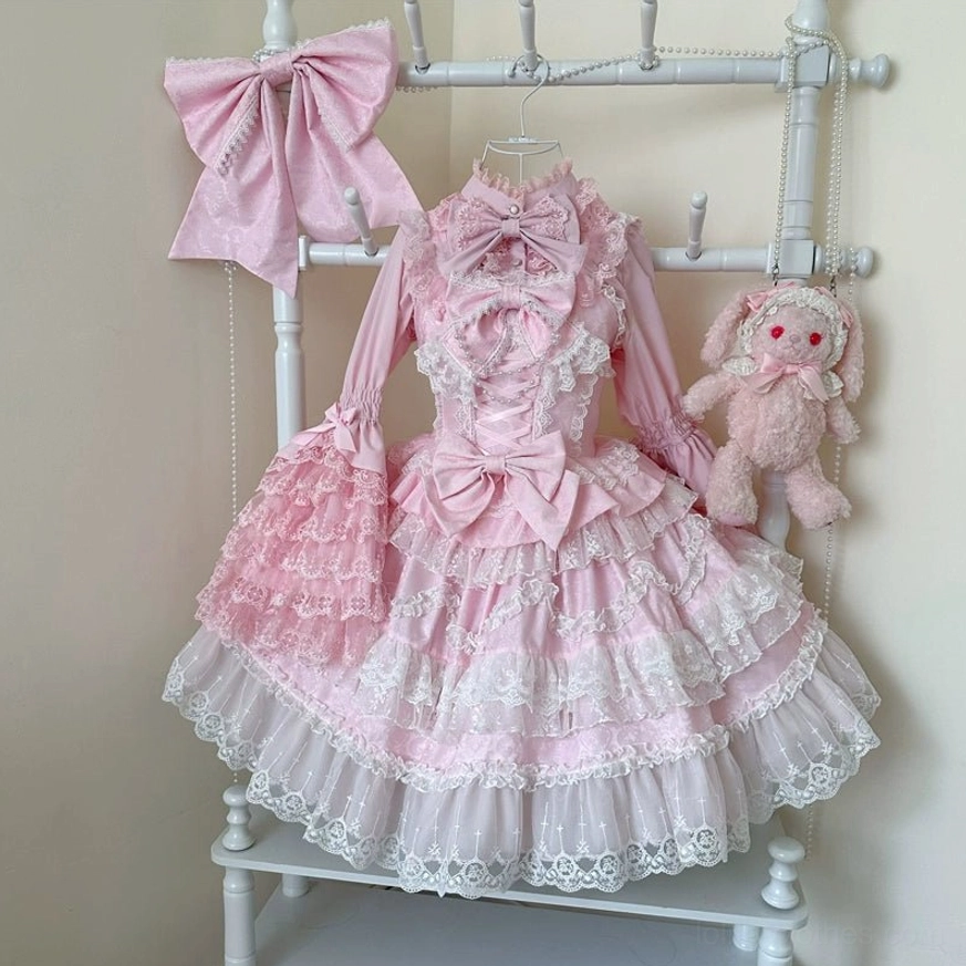Apricot sweet wedding lolita JSK dress full-body standing view showing tiered ruffled hem and pearl embellishments