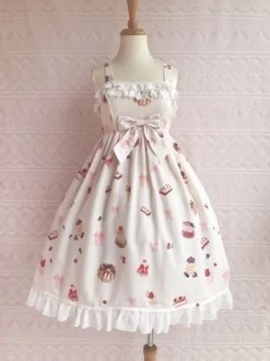 Apricot kawaii lolita dessert printed JSK jumper skirt dress with white lace collar and hem ruffles, front waist bow detail, and full all-over cute dessert printing pattern