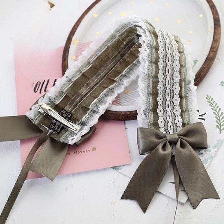 Army green polyester lace bow headband featuring extended satin ribbon tail and comfortable adjustable metal hair clips