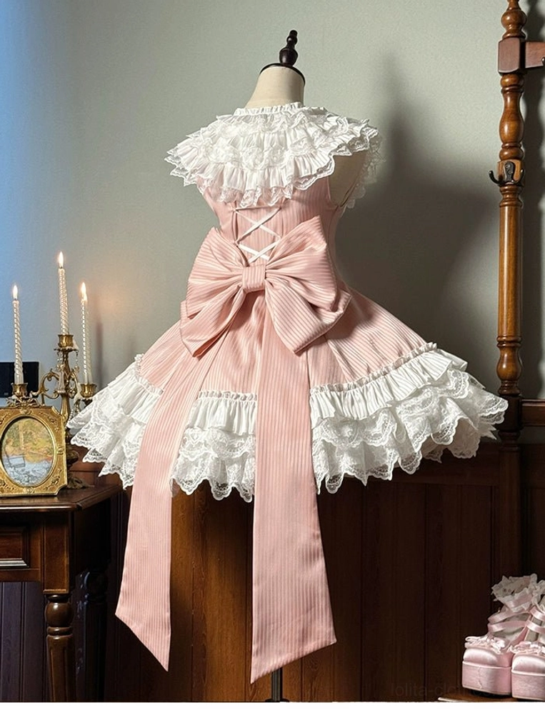 Pink striped sweet lolita short dress rear view showing oversized bow with cascading trailing ribbons