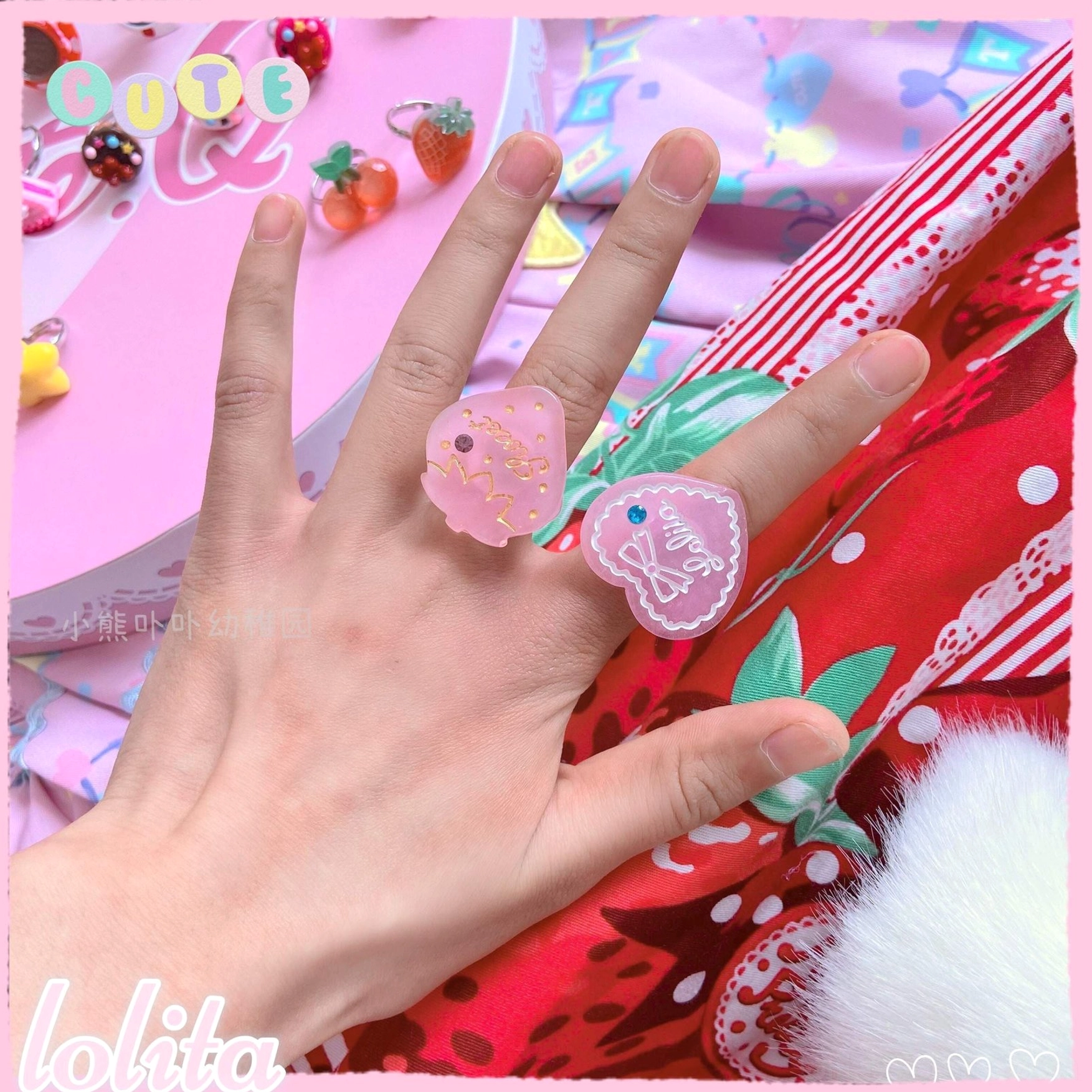 Assorted kawaii lolita ring designs in cupcake heart star and strawberry cake styles with vibrant candy-colored resin