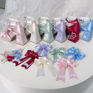 Assorted pastel sweet lolita chunky heel platform shoes in multiple colors with detachable matching decorative bows flat lay product display