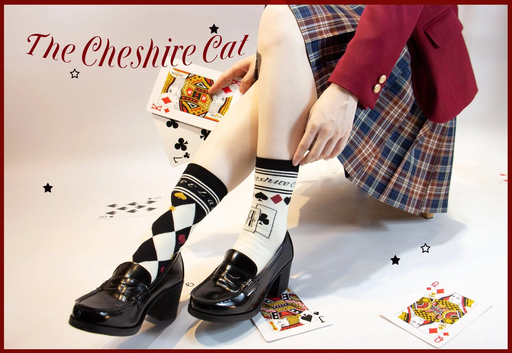Multiple asymmetrical lolita cotton socks color collection display black white blue gray pink on decorative backdrop