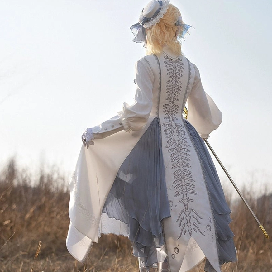 Asymmetrical Lolita skirt tier construction irregular hemline architecture white satin flat-lay detail