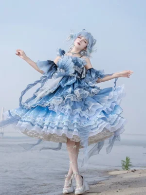 Azure Breath jellyfish lolita jumper dress back dynamic spinning view showcasing fluttering voluminous layered tiered skirt and detachable shoulder straps at waterfront location