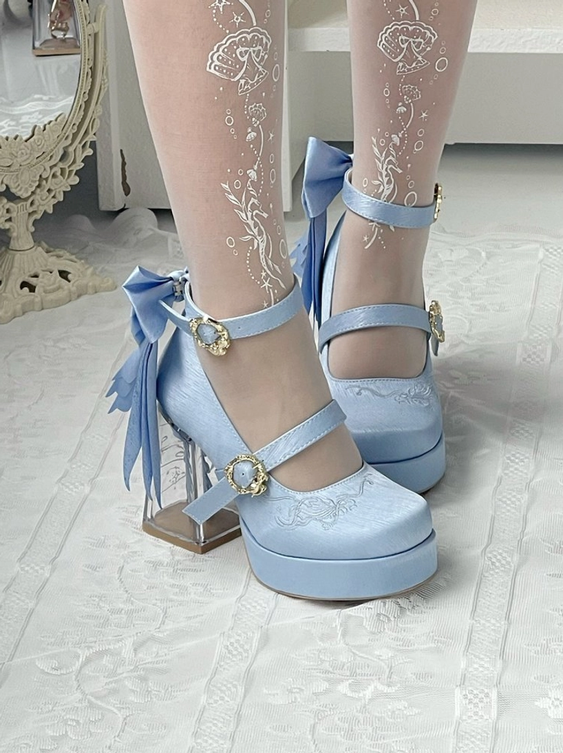 Baby blue classic lolita platform heels close-up side view dual ankle straps gold buckles large back bows