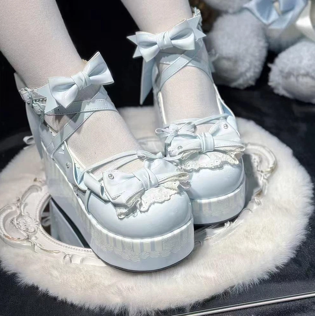 Baby blue sweet lolita platform Mary Jane shoes with pastel upper, lace trims, ankle strap bow, wearing flat on fuzzy mirror cushion with white stockings