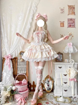 Ballet-inspired sweet lolita dress set in beige featuring corset-style bodice with pink ribbon lacing and tiered ruffle skirt with lace edging vintage bedroom setting with blonde model and pink hair bow