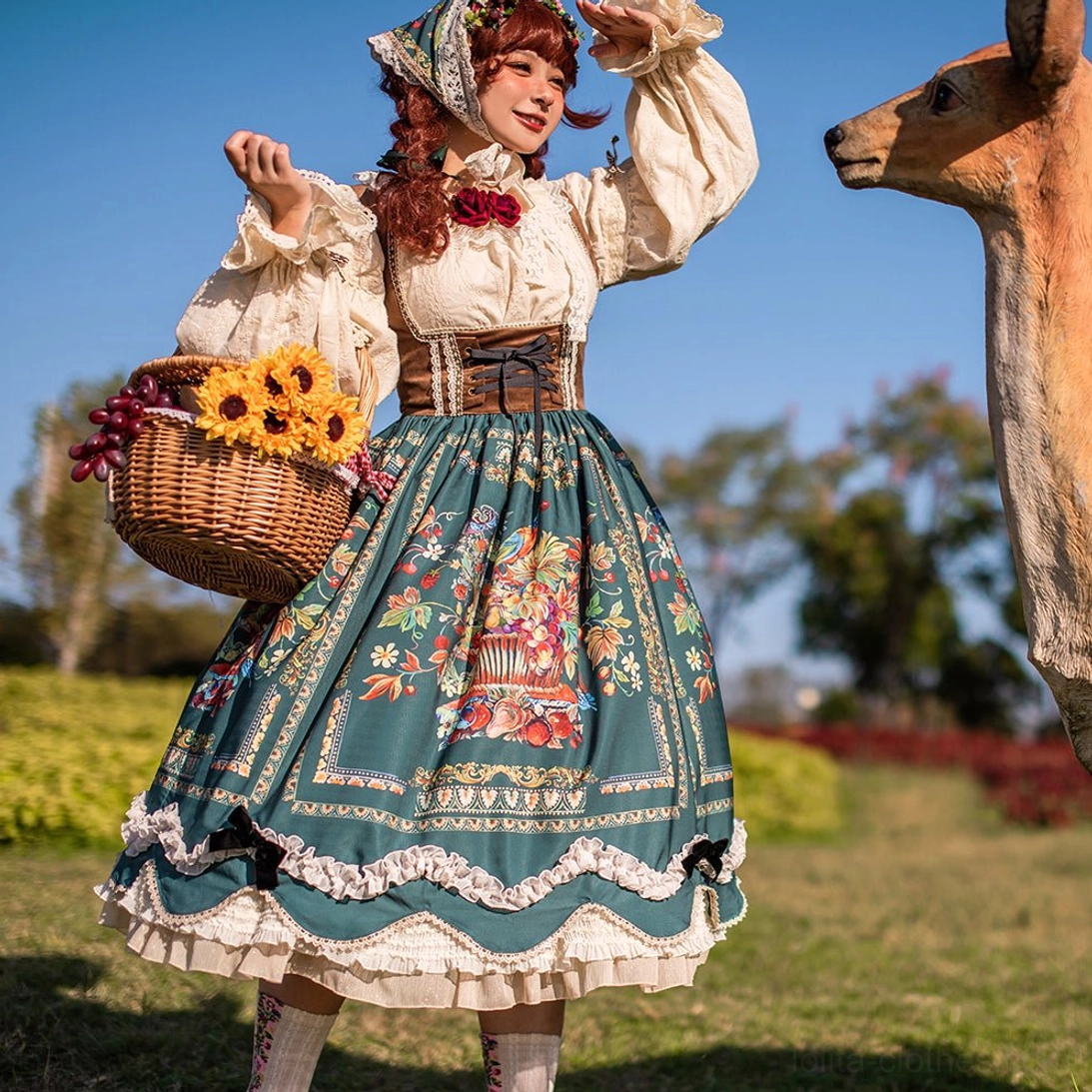 Bavarian Lolita JSK full view model wearing green chest-support version in Alpine flower meadow setting