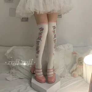 bean paste sweet lolita thigh-high cotton socks with cherry and ribbon prints pink cuff trim model wearing white tulle skirt mary jane shoes bedroom setting