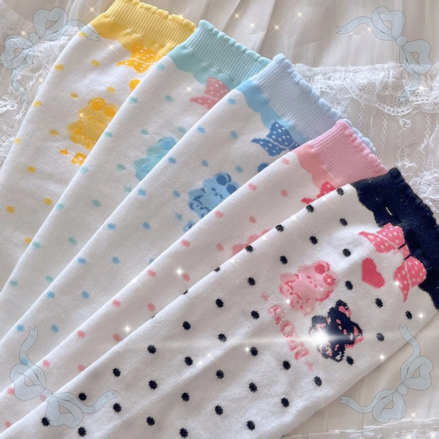 Assorted bear and bunny lolita calf socks collection in pastel colors with polka dot patterns and cute cartoon prints displayed flat lay