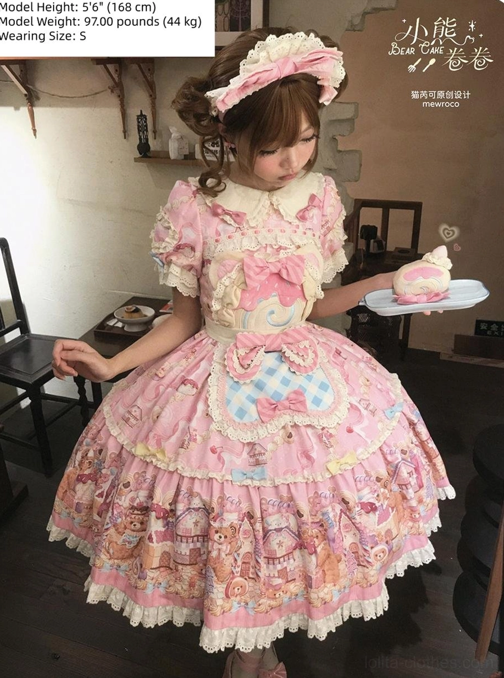 Bear Cake Sweet Lolita OP dress worn in vintage café setting with model holding dessert plate and small cake, showcasing Peter Pan collar, gingham apron, and lace-trimmed layered skirt