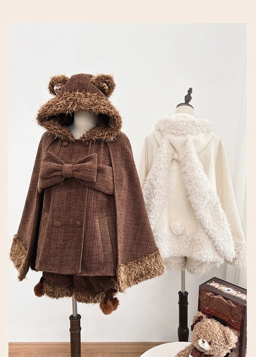 Model wearing bear ear hooded lolita cape and pom-pom shorts in mixed coordination styling showing how to adapt kawaii pieces for non-traditional fashion contexts