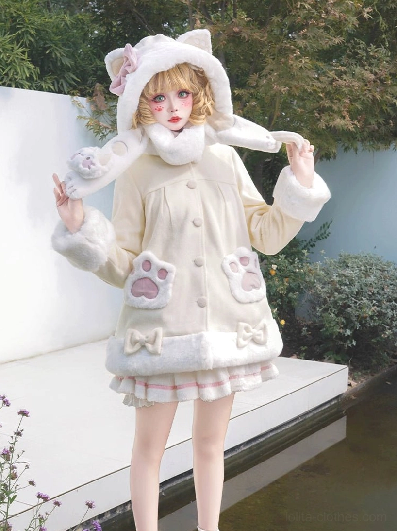 Beige cat ear hooded lolita winter plush coat with paw-shaped pocket patches and bow details, outdoor garden setting with blonde model