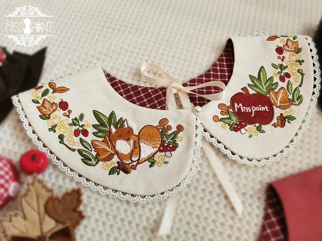 Beige color lolita peter pan faux collar embroidered fox and plant details white lace edge delicate needlework overhead flat lay view