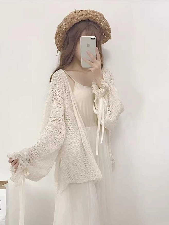 Beige hollow crochet cardigan right side view displaying satin ribbon-tied lantern sleeves and loose open front fit with crocheted hollow texture