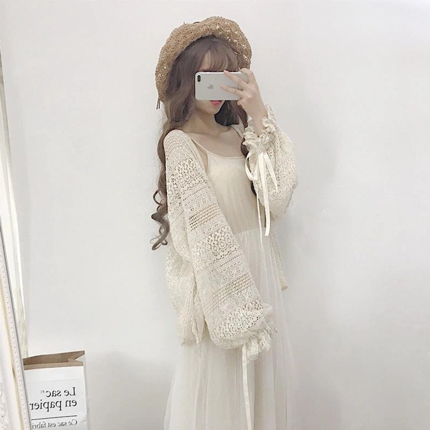 Beige hollow crochet lolita cardigan adjustable satin ribbon sleeves and loose-fit design detail shot for various body types and personalized styling