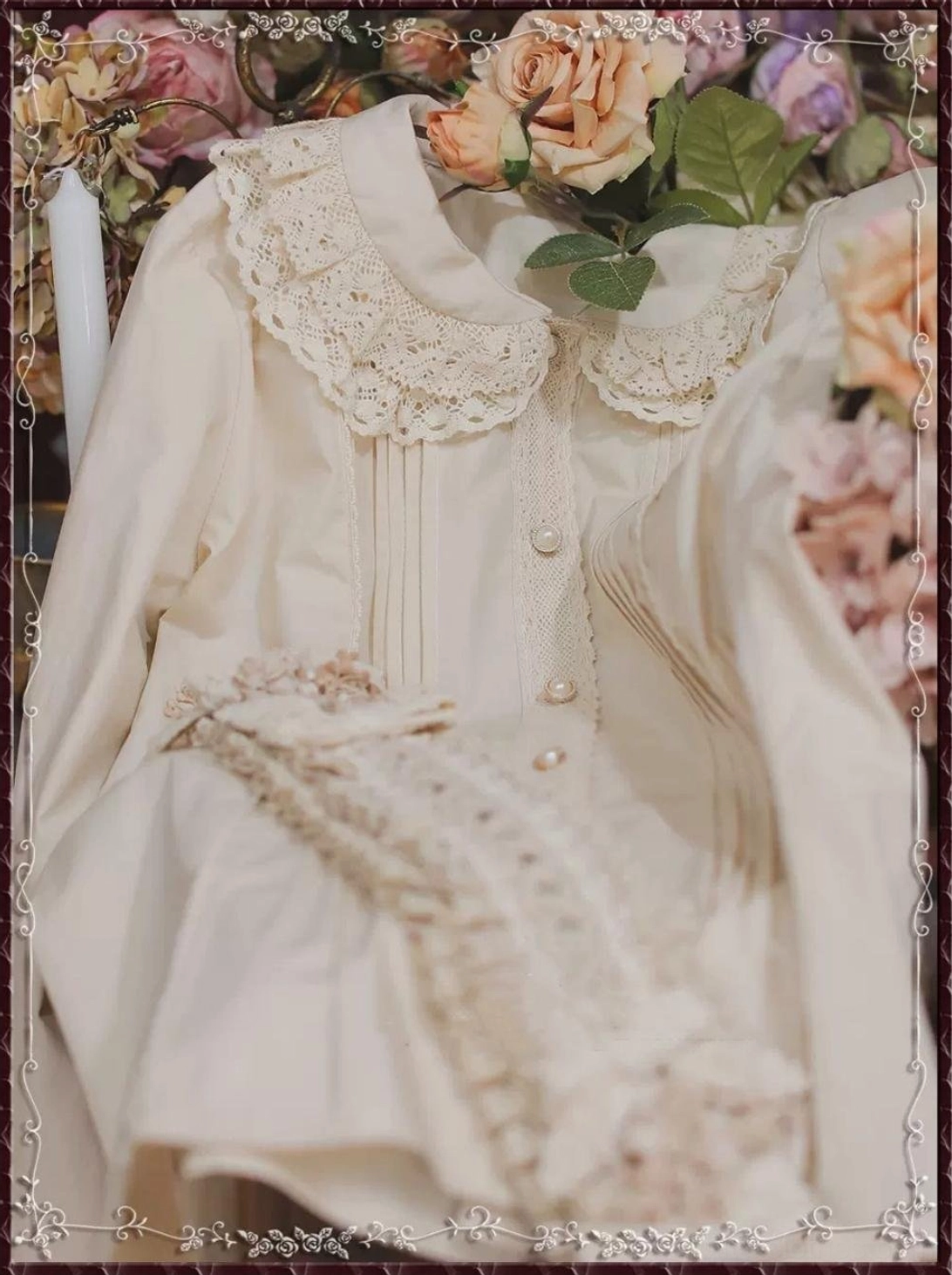 Beige vintage lace Peter Pan collar cotton Lolita blouse partial flat lay showing crocheted lace collar and pearl buttons detail