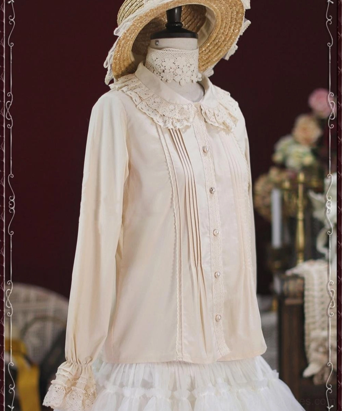 Beige vintage lace cotton Lolita blouse right side profile view on mannequin with straw hat vintage candle and floral background