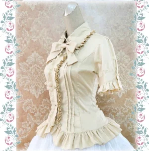 Beige sweet Lolita cotton blouse three-quarter front angle view fitted waist silhouette ruffled hem on mannequin