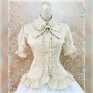 Beige short-sleeve Peter Pan collar Lolita cotton blouse front view with detachable bow tie and ruffled placket on dress form