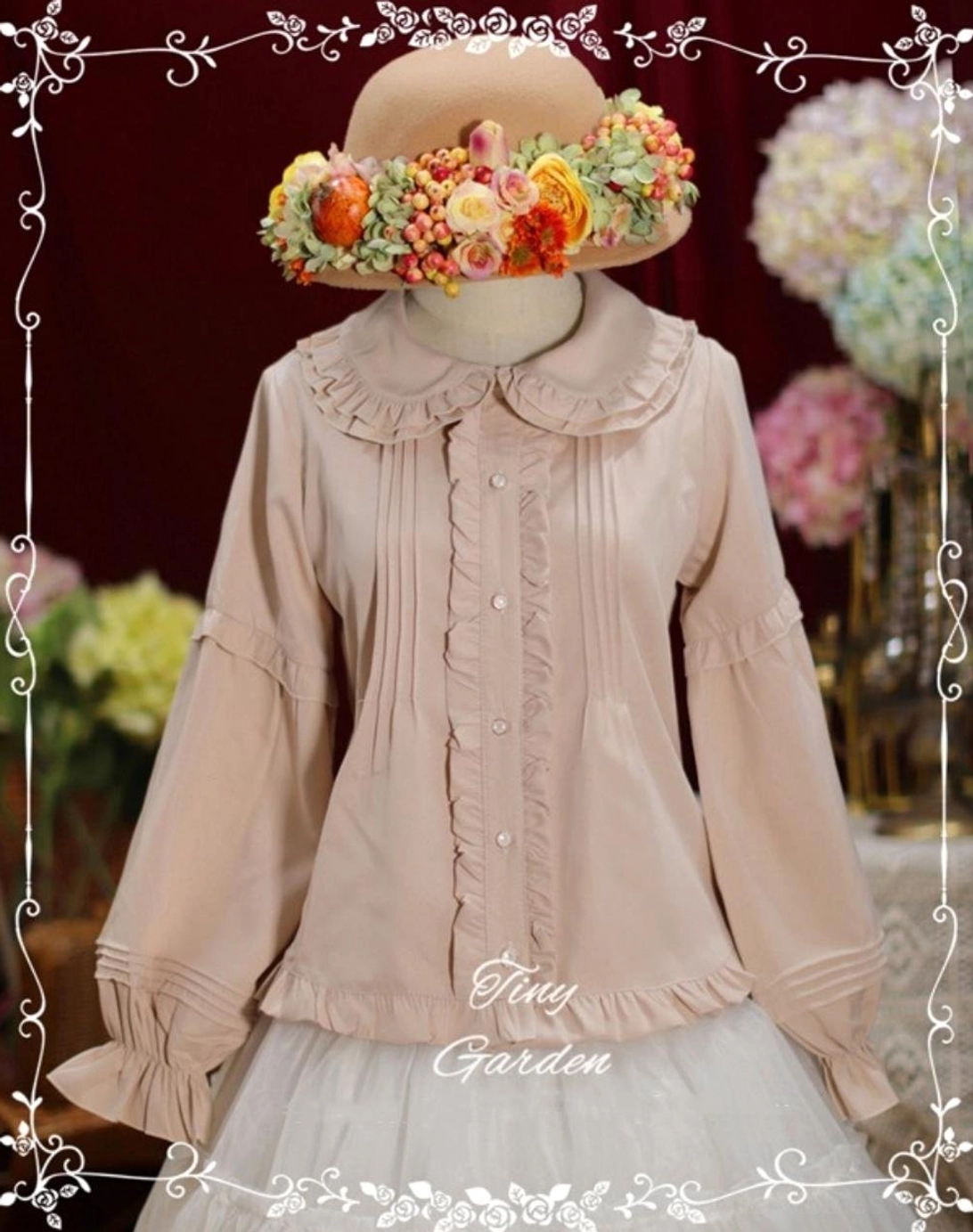 Light beige long-sleeve Lolita blouse with soft fabric, ruffled Peter Pan collar, and pin-tuck pleated details on dress form with floral wreath accessory