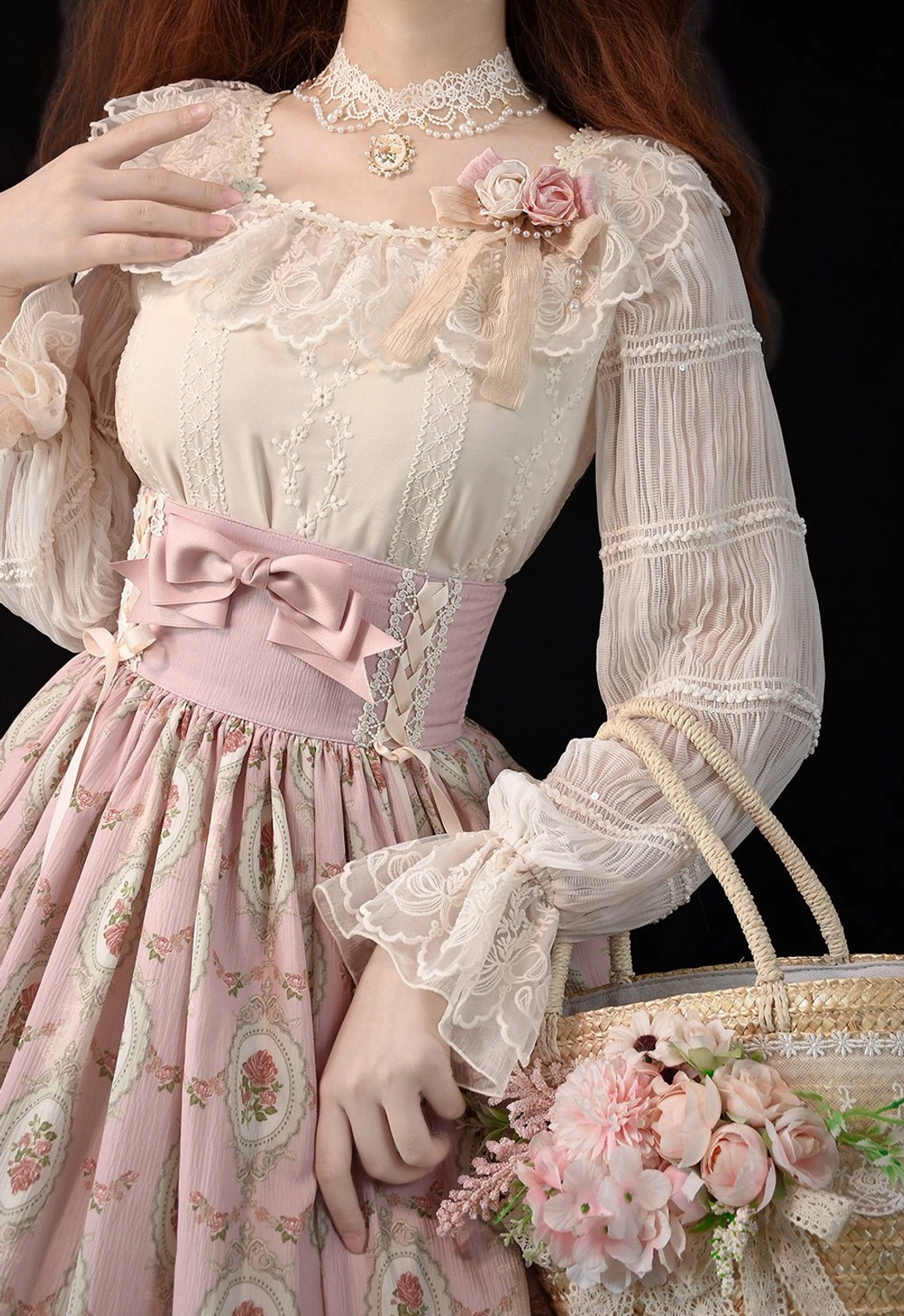 Model wearing cream beige Lolita blouse with ruffled lace sleeves, pearl choker, and holding vintage floral accessories