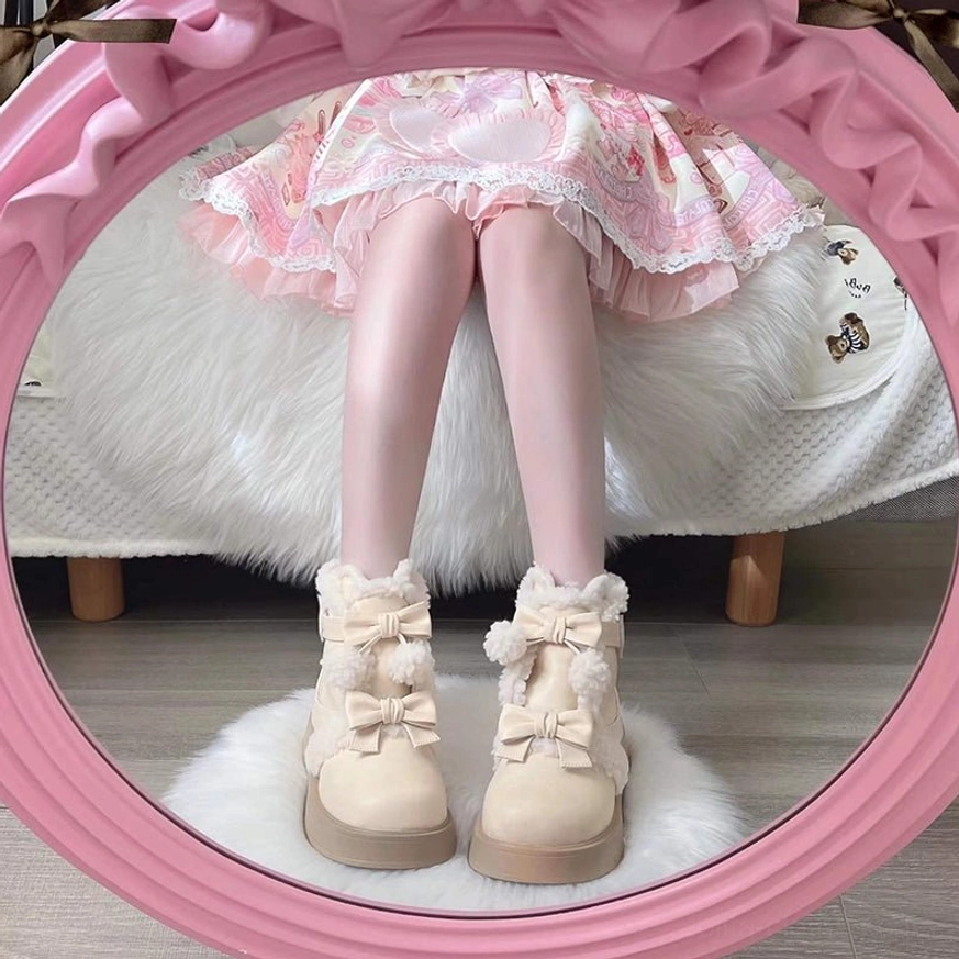 On-foot wearing effect of beige lolita boots pink-framed mirror reflection with model wearing pink lolita skirt fluffy vanity chair