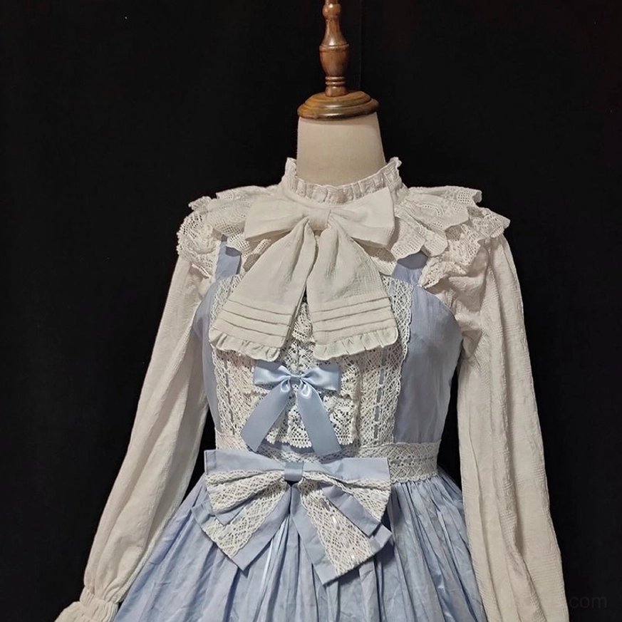 Beige lolita cotton blouse displayed on dress form with blue-grey lolita dress front medium shot showing vintage sweet lolita silhouette and coordination