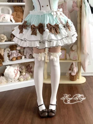 Beige lolita over-knee socks with fluffy pom-pom ruffle cuffs styled with mint sweet lolita dress and brown flats front side angle