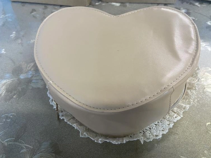 Minimalist beige heart-shaped Sweet Lolita handbag with polished finish hidden zipper and delicate lace trim