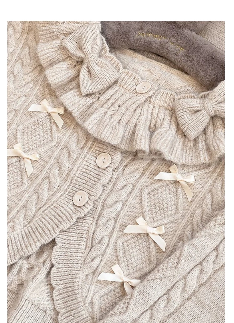 Beige Oatmeal Cropped Lolita Cardigan Flat Lay Knit Fabric Bows Ruffled Collar Round Buttons Cable Knit Pattern