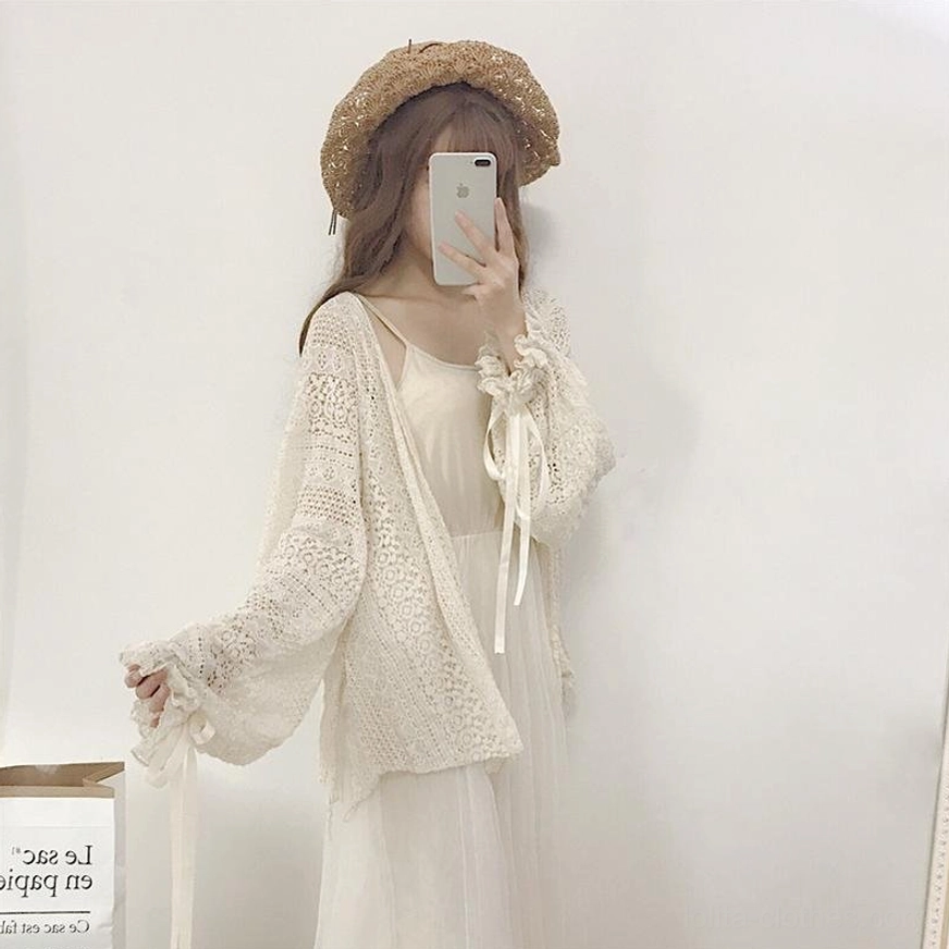 Beige oversized lolita cardigan showing the soft fabric drape and hollow crochet construction with open front silhouette for comfortable layering