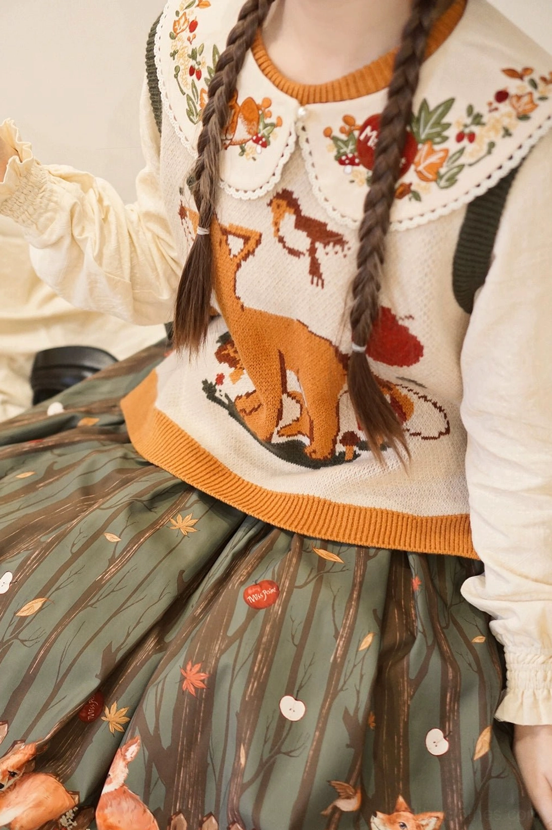 Beige lolita peter pan embroidered collar with delicate fox and botanical embroidery lace hem trim pearl button closure flat lay detail shot