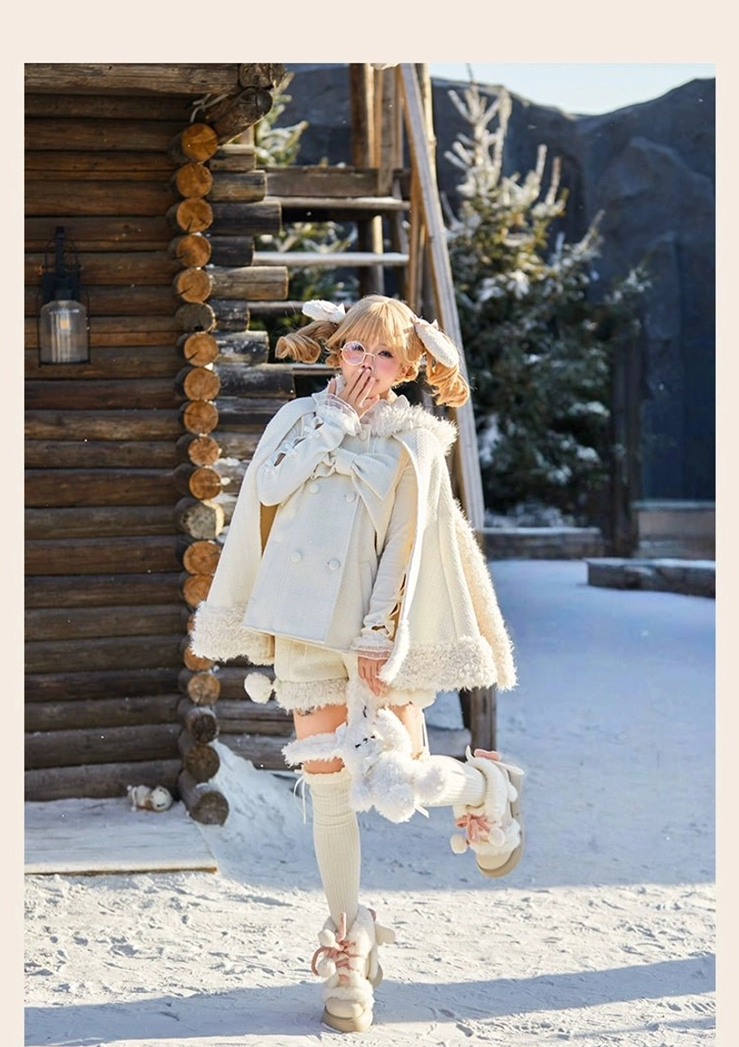 Beige rabbit lolita cape shorts set overhead flat lay showing hood ear details, front bow attachment point, pocket placements and full garment construction layout